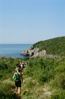 freedivers walking down the path to the divesite 